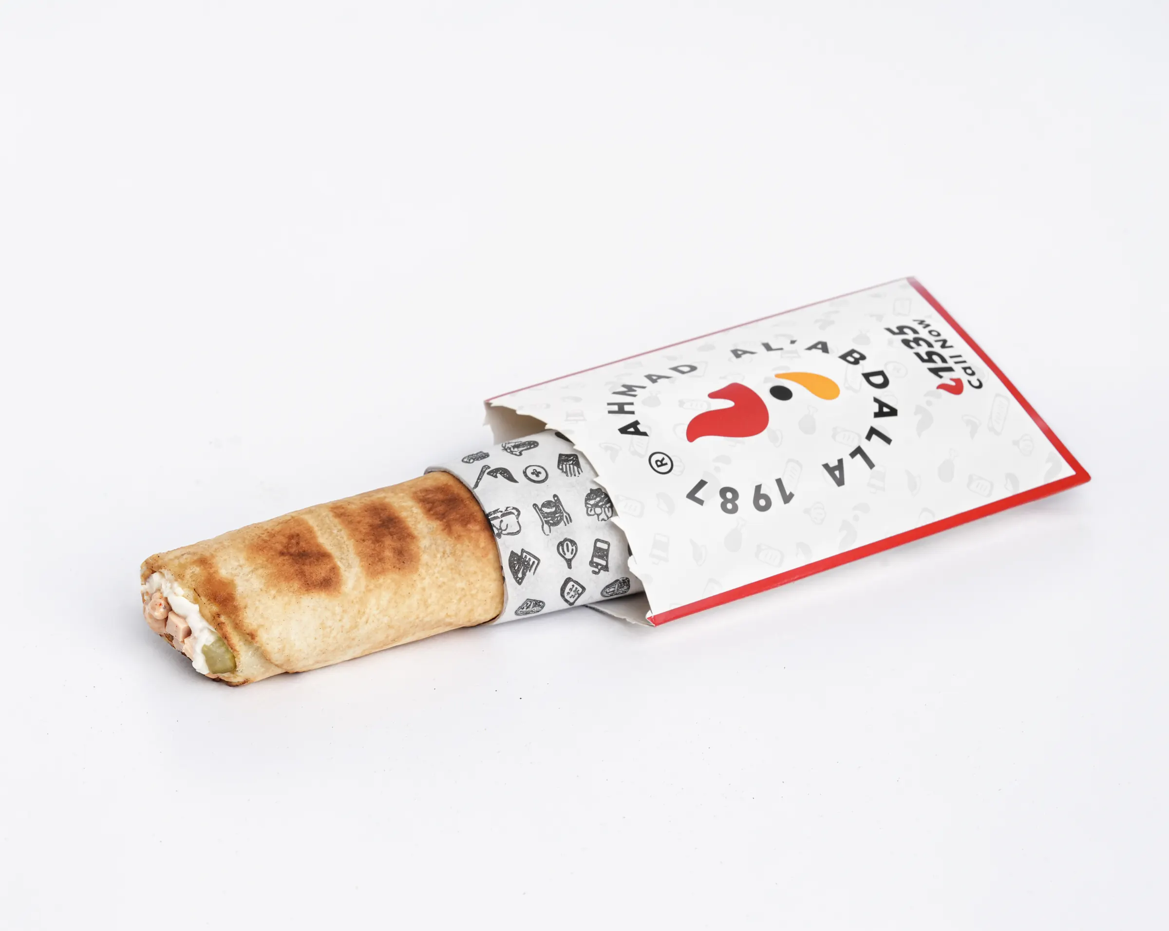 Ahmad Al’Abdalla sandwich in branded packaging on a white background